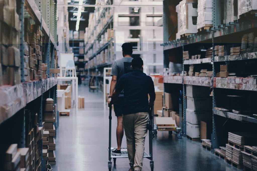 Security officer inside a warehouse aisle
