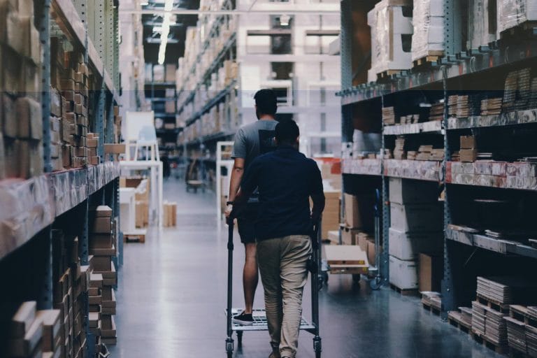 Security officer inside a warehouse aisle